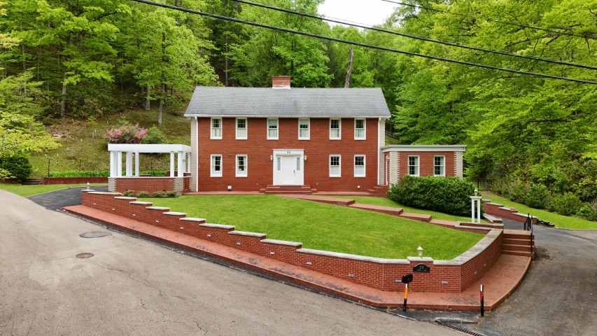 Brick residence used as an example of real estate auction property